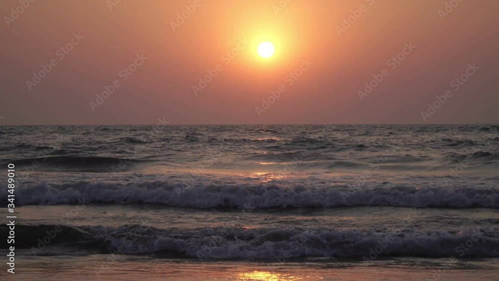 Evening, marine background. Beautiful sunset over the sea, India, Goa Evening, marine background. Beautiful sunset over the sea, India, Goa