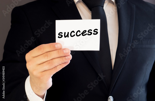 Business hand and word success