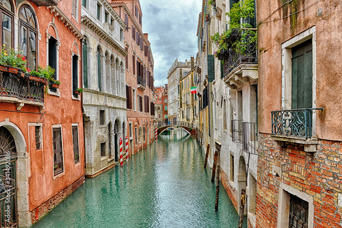 Canal with boats in Venice (Italy) on a cloudy day in late autumn © othman