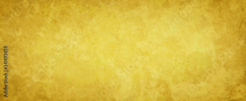 Yellow gold background with vintage texture, abstract solid elegant marbled textured paper design