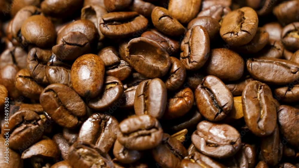 Coffee beans roasted. Close up of seeds of coffee. Macro shot, rotating left. Coffee beans roasted. Close up of seeds of coffee. Macro shot, rotating left.