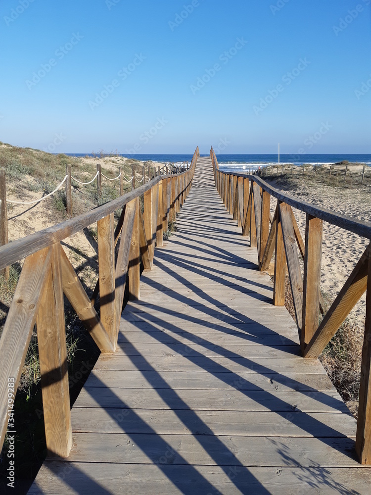 wooden platform road to the beach to the Mediterranean Sea