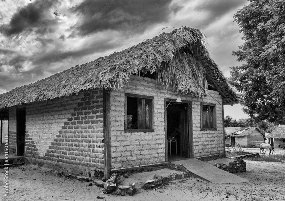 Obraz premium Typical Mumbuca village house, roof made out of palms