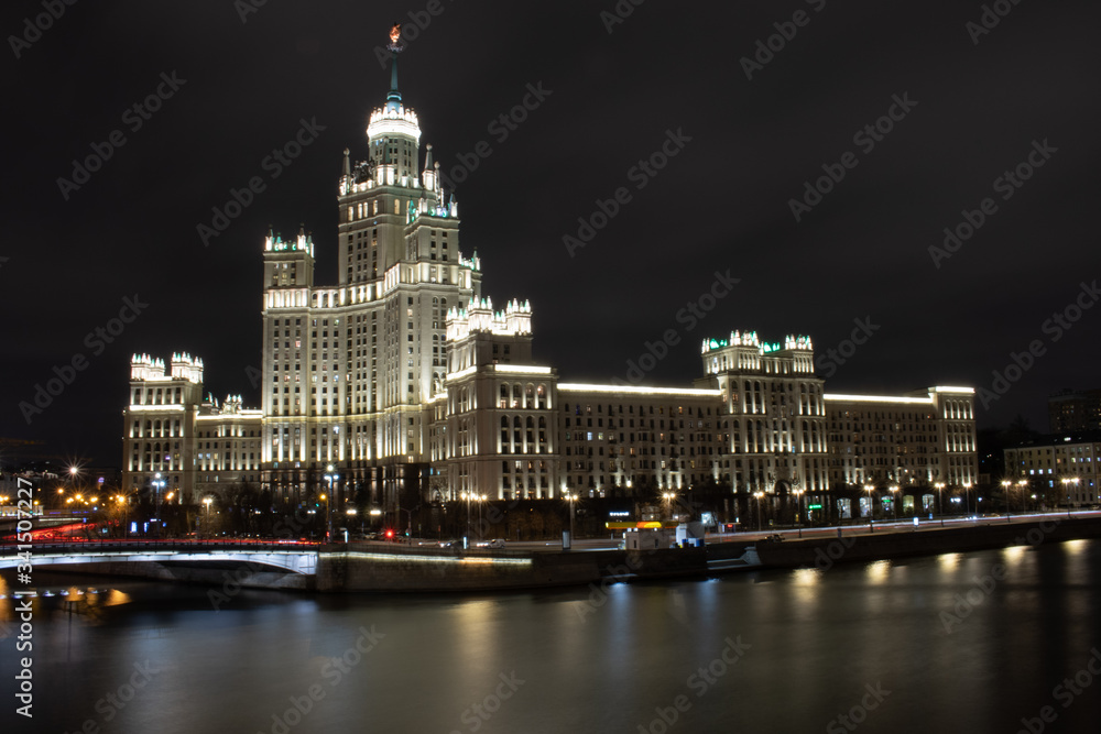 Night view of the Moscow river and high-rise on Kotelnicheskaya Embankment, Russia, Moscow