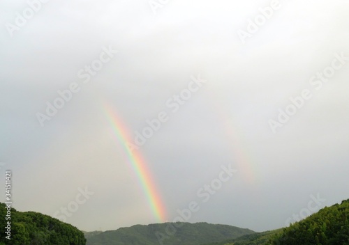 日本の田舎の風景 7月 虹と曇り空