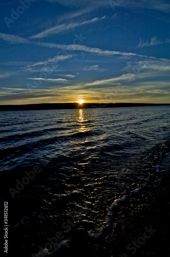 Starburst at sunset over Lake Abert, Oregon photo