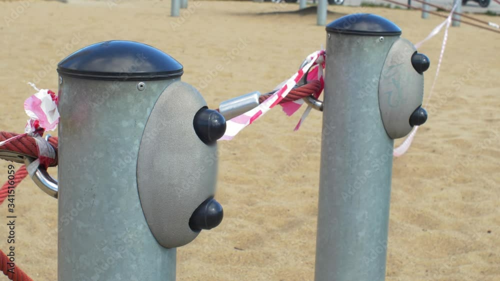 Caution Tape on Empty Playground Closed due to Coronavirus Epidemic Quarantine Caution Tape on Empty Playground Closed due to Coronavirus Epidemic Quarantine