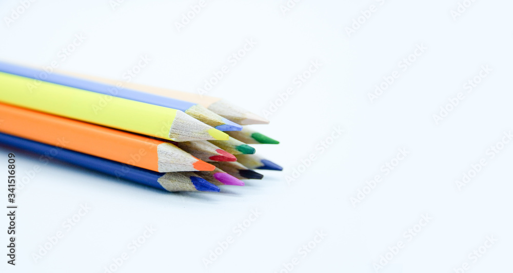 Photo of arrangement of color pencils isolated on white background. Blank space for text. Flat lay. Close up. Top view. Leadership business concept. School concept. Rainbow color pencil. Photo of arrangement of color pencils isolated on white background. Blank space for text. Flat lay. Close up. Top view. Leadership business concept. School concept. Rainbow color pencil.