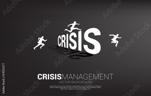 Silhouette businessman jumping across Crisis. Background concept for crisis management and challenge in business