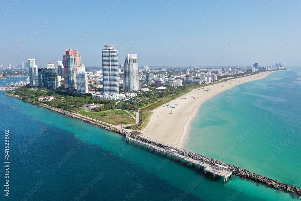 Aerial view of South Pointe Park and South Beach in Miami Beach, Florida devoid of people under coronavirus pandemic beach and park closure.