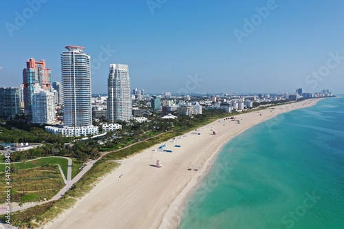 Aerial view of South Pointe Park and South Beach in Miami Beach, Florida devoid of people under coronavirus pandemic beach and park closure.