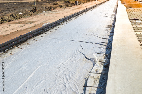 geotextile with tie bars and wire mesh concrete road construction site  .
