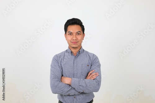 South east Asian Malay Man facial expression confident arms over chest look forward