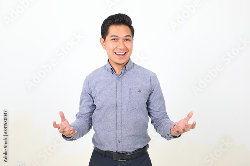 фотографія South east Asian Malay Man facial expression happy exited harms spread