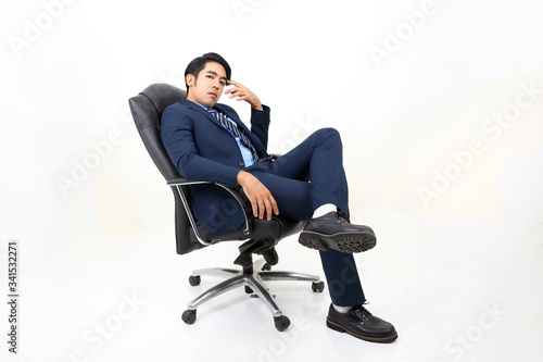 South east Asian Malay Man facial expression sit on chair thinking