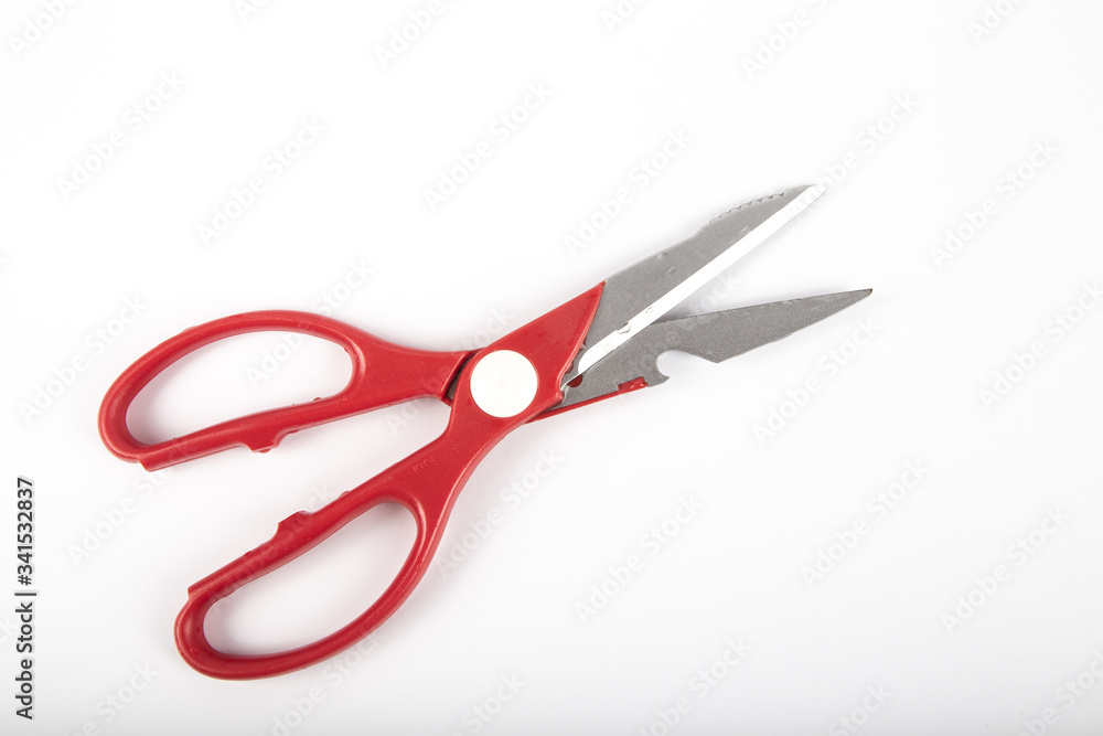 Scissors with red plastic handles, on a white background. Scissors with red plastic handles, on a white background.