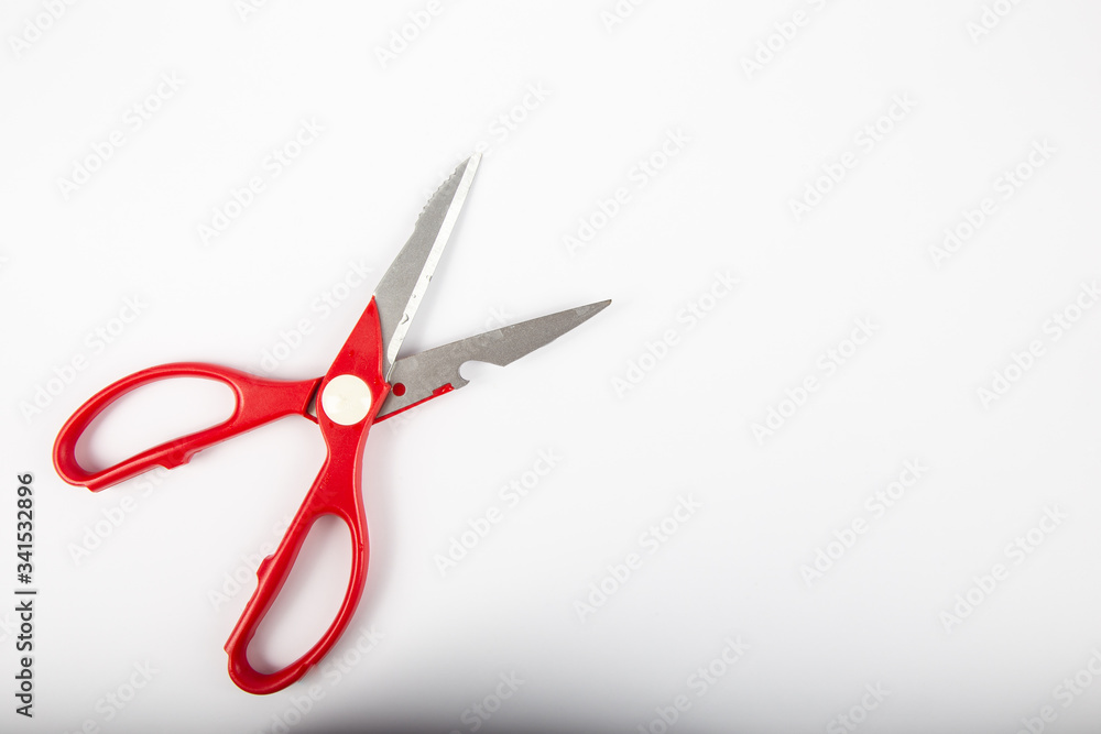 Scissors with red plastic handles, on a white background. Scissors with red plastic handles, on a white background.