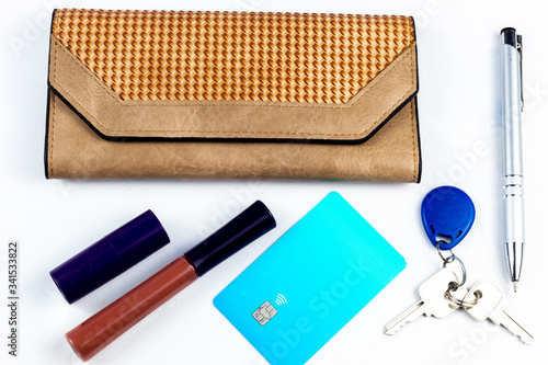 women's purse wallet, pen, keys with electric tag and purple credit card
