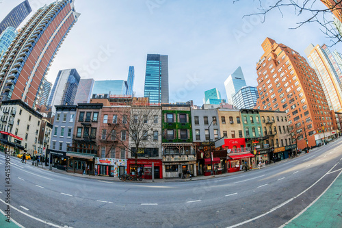 Photography Street and facades of old colorful buildings in Manhattan, New York, USA