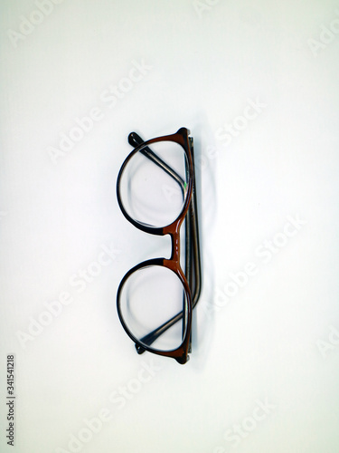 Brown glasses on white background.