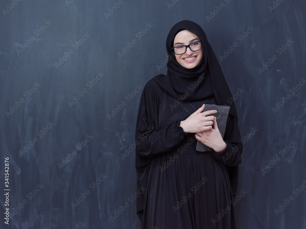 young muslim business woman using tablet computer young muslim business woman using tablet computer