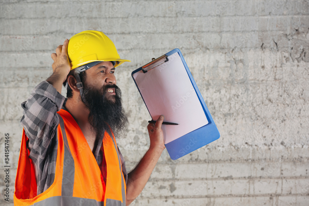 Construction worker with document, plan working for the inside building construction site. Construction worker with document, plan working for the inside building construction site.