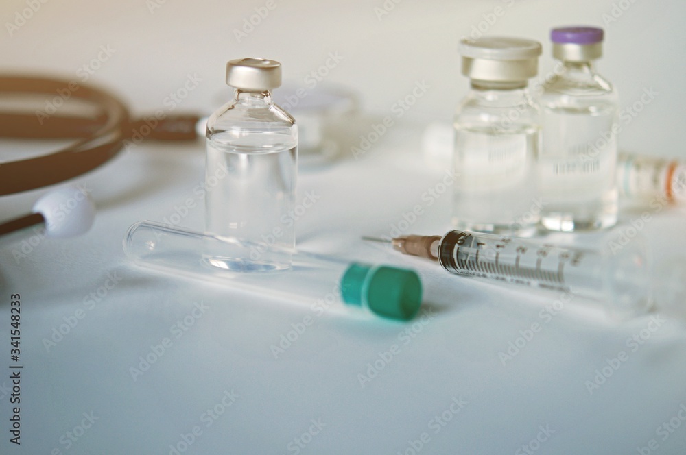 Medicine in vials and syringe , ready for vaccine injection , Cancer Treatment , Pain Treatment and can also be abused for an illegal use, healthcare and medical concept vaccination. Medicine in vials and syringe , ready for vaccine injection , Cancer Treatment , Pain Treatment and can also be abused for an illegal use, healthcare and medical concept vaccination.