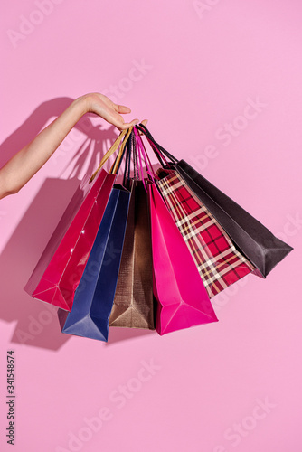 Foto Shopaholic woman with shopping bags