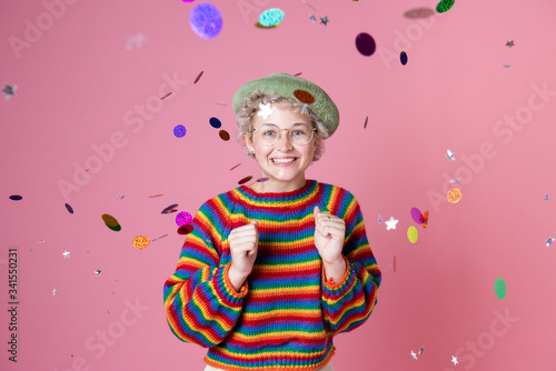 Playful and cheerful girl in a confetti