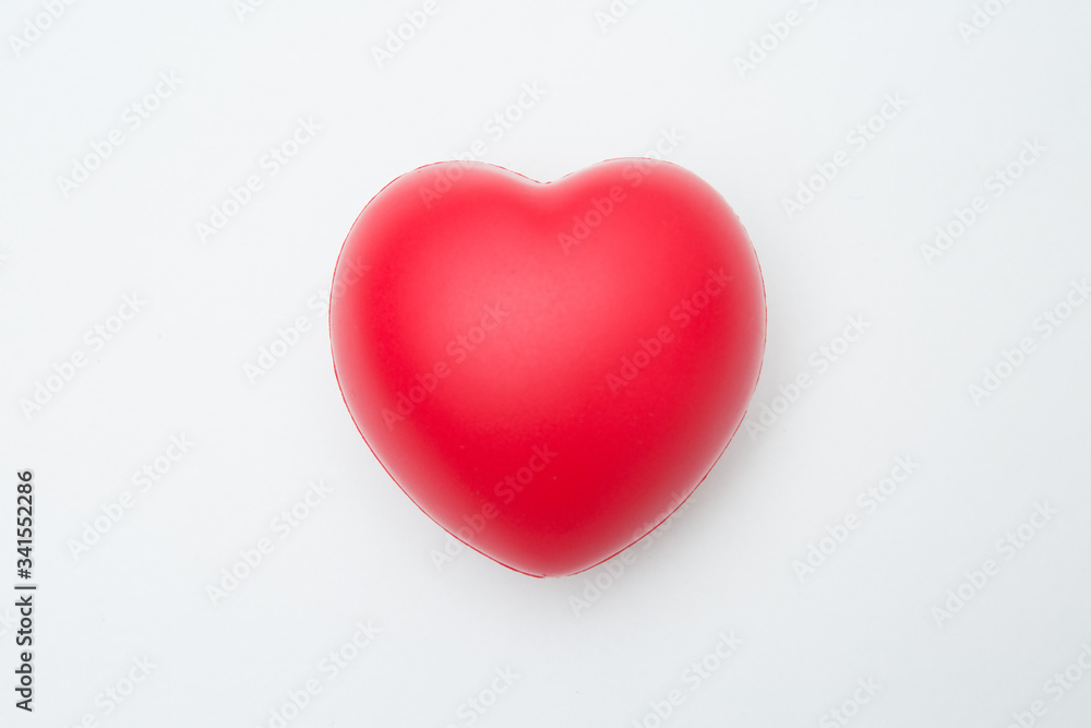 Heart shaped squeeze ball for hand muscle exercise  on white background