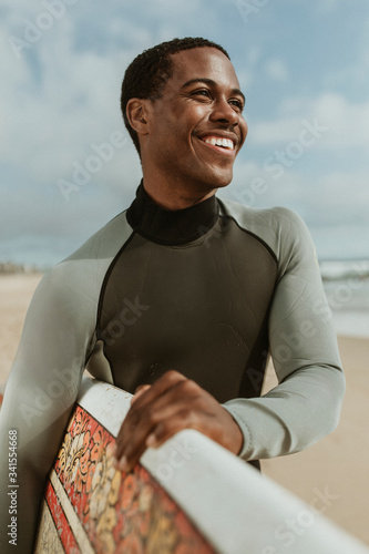 Smiling male surfer