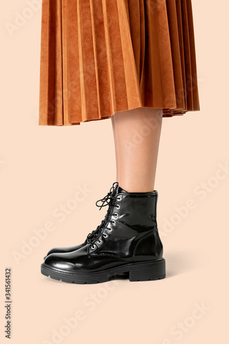 Woman in a skirt wearing combat boots photo