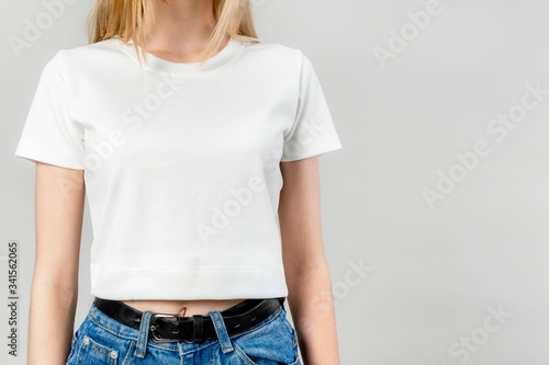 Young blonde girl wearing white t-shirt