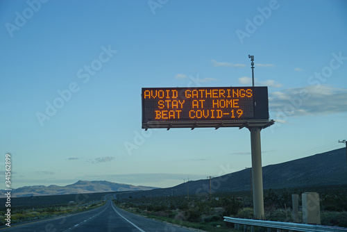 Avoid Gatherings Stay At Home Highway Sign