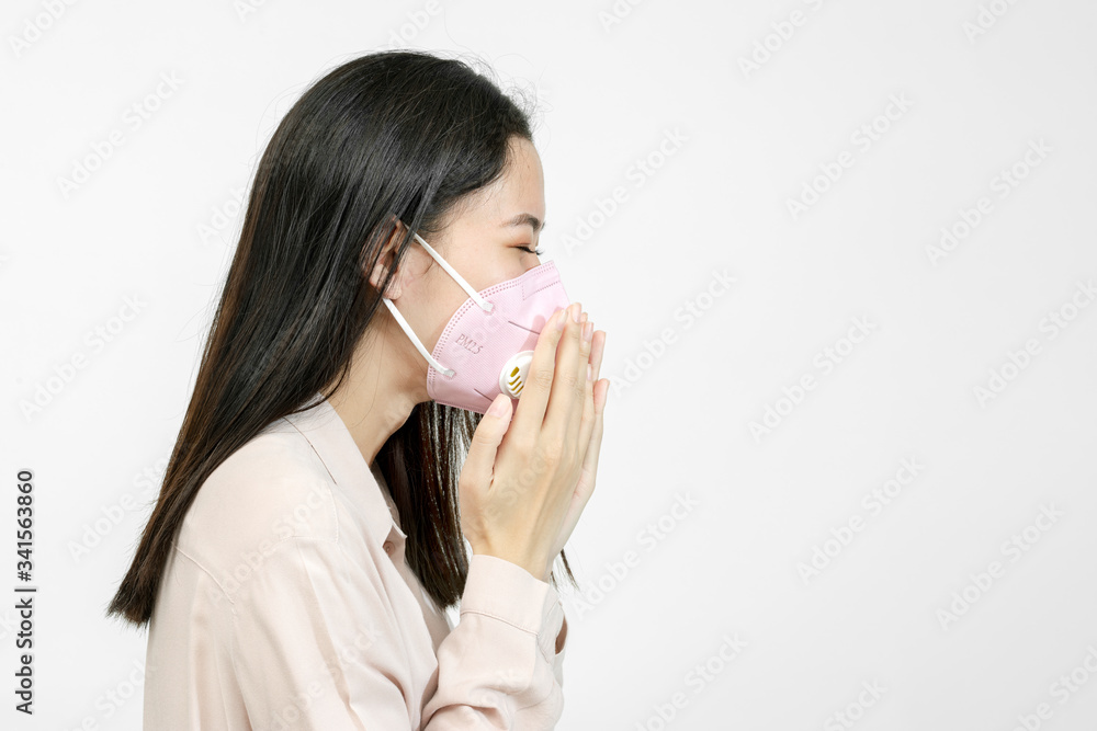 Asian woman wearing a mask and coughing Asian woman wearing a mask and coughing