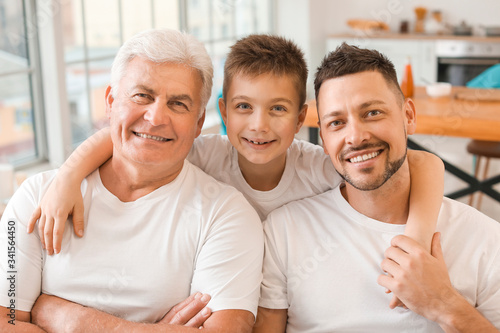 Man with his father and son at home