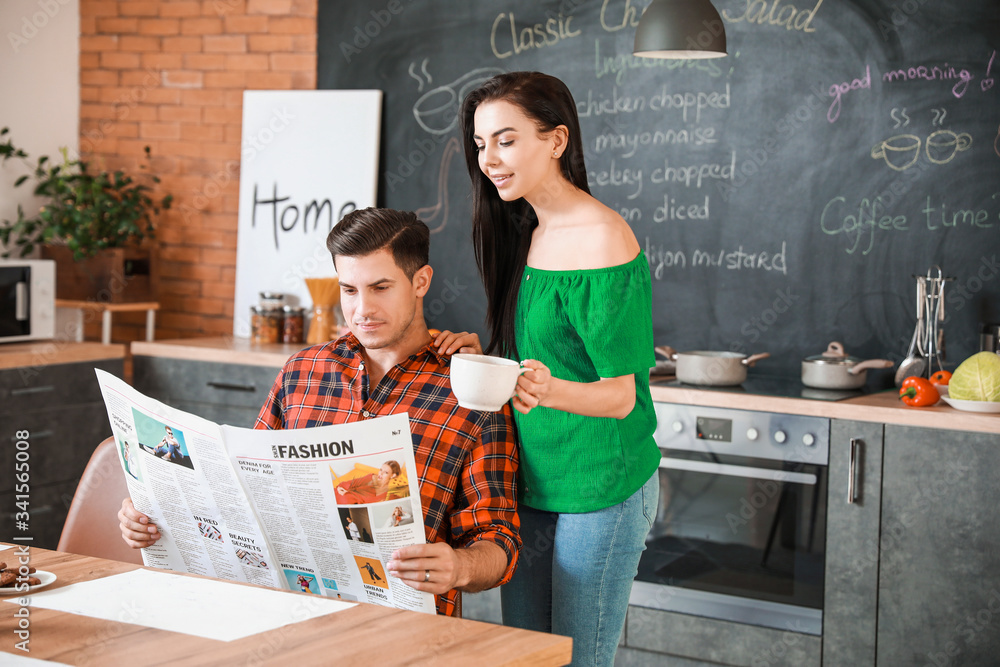 Fototapeta premium Happy young couple in kitchen