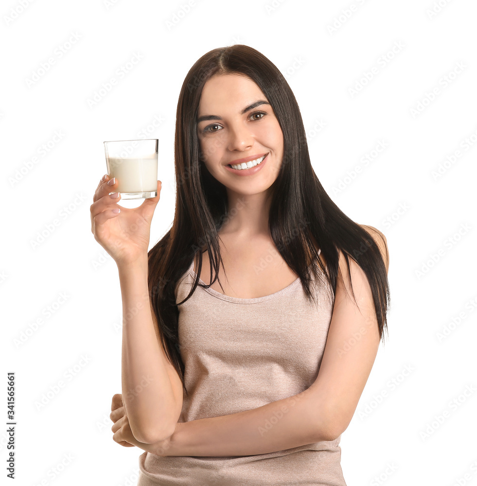 Beautiful young woman with milk on white background Beautiful young woman with milk on white background