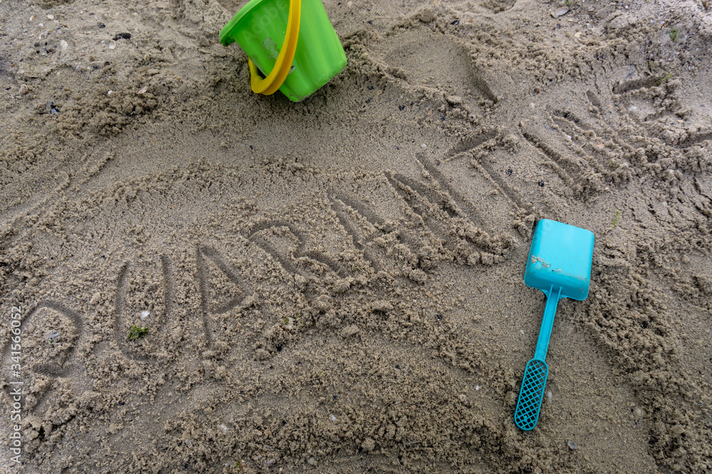 Print on a sand describing current challenging situation aroun the world regarding to corona virus covid-19 Print on a sand describing current challenging situation aroun the world regarding to corona virus covid-19