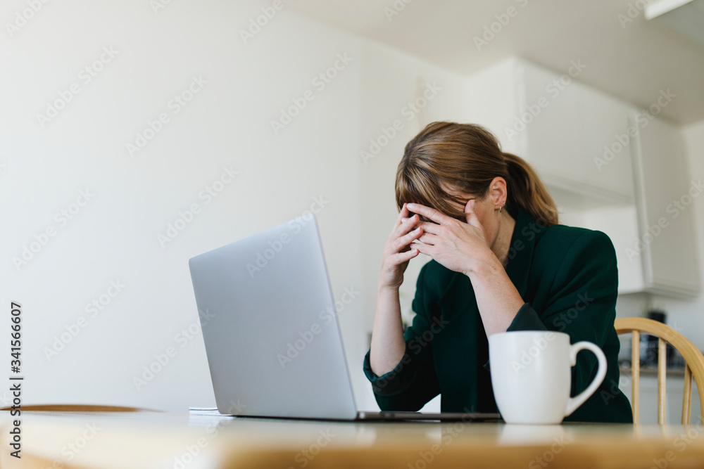 Stressed out woman working at home during coronavirus pandemic Stressed out woman working at home during coronavirus pandemic