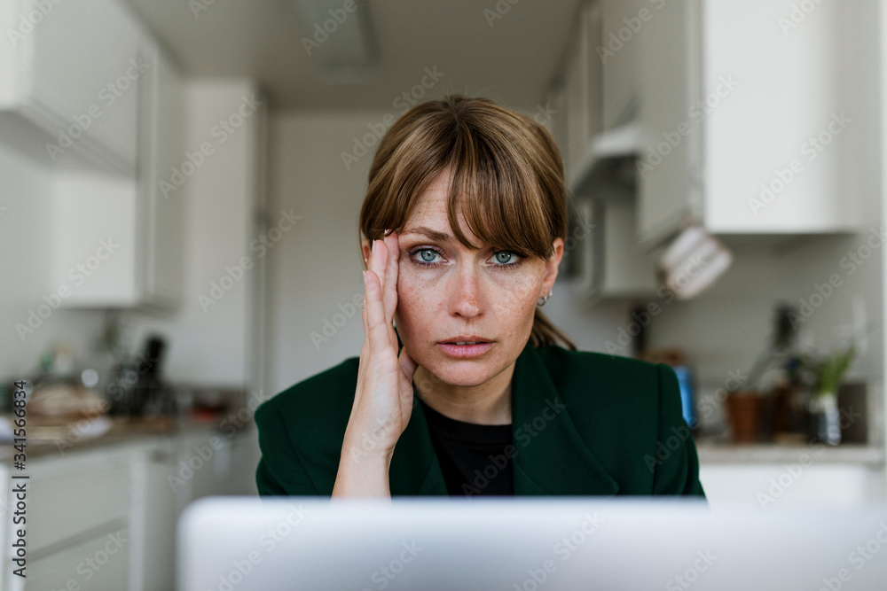 Stressed out woman working at home during coronavirus pandemic Stressed out woman working at home during coronavirus pandemic