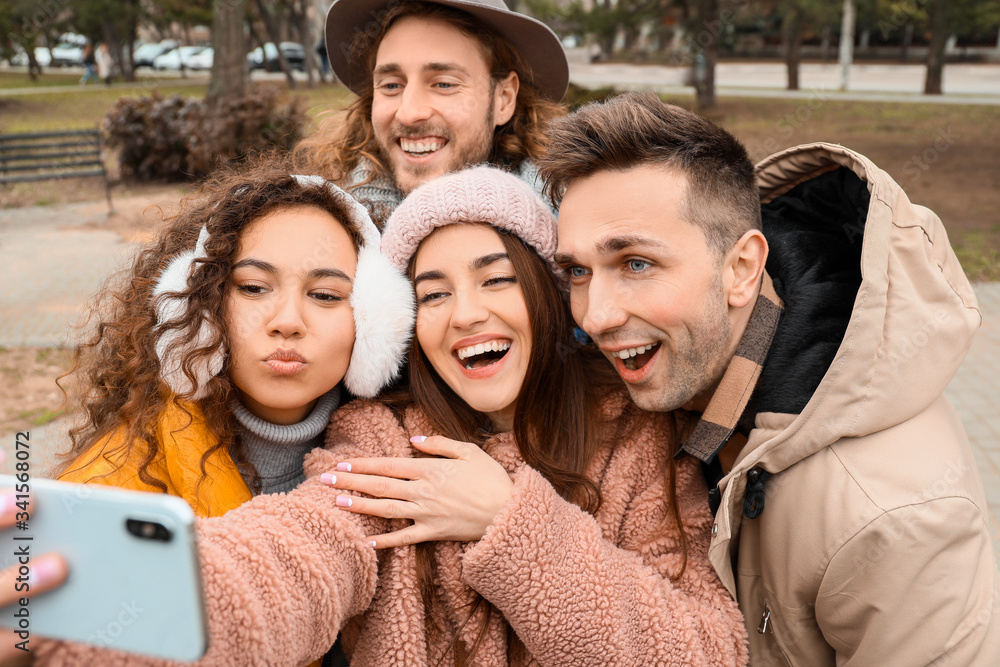 Fototapeta premium Happy friends taking selfie outdoors