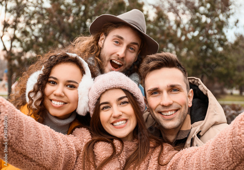 Happy friends taking selfie...
