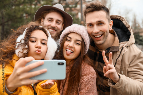 Happy friends taking selfie...