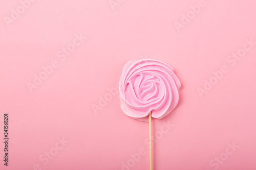 Pink  Rose candy in pastel colors on a wooden stick on a grey  background, Valentine, Mother's Day.