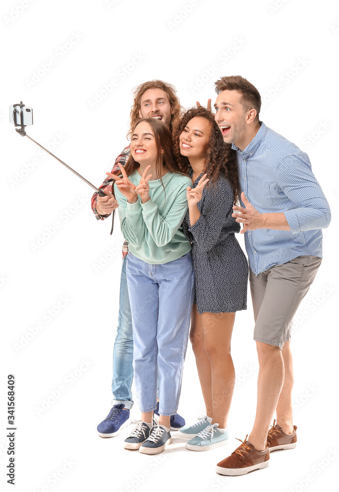 Fototapeta premium Friends taking selfie on white background
