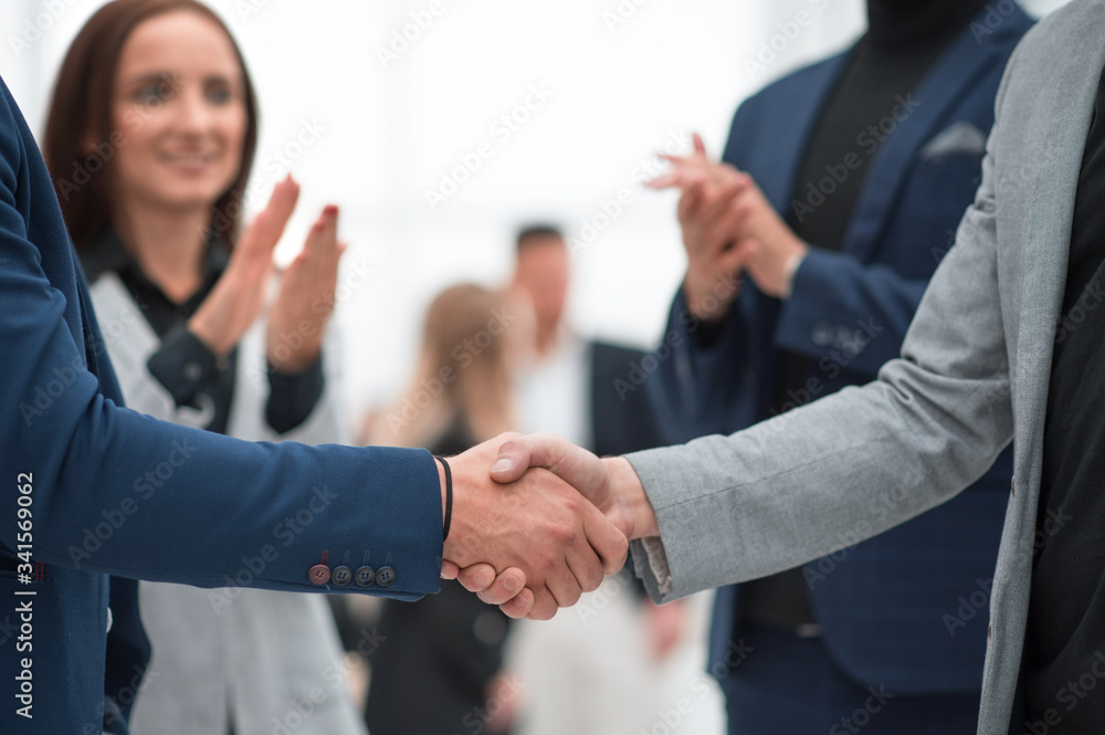 business people greeting each other with a handshake
