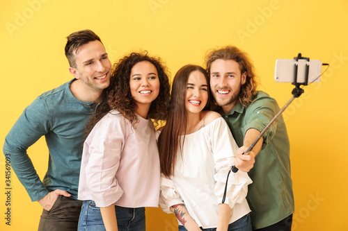 Friends taking selfie on co...