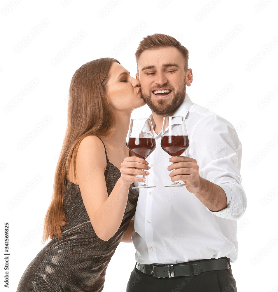 Happy couple with glasses of wine on white background Happy couple with glasses of wine on white background