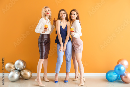 Happy women with cocktails ...